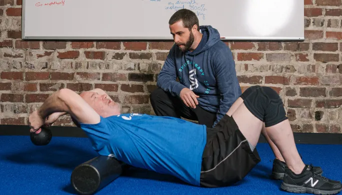 Physical therapist working one-on-one with a patient at Shift Therapy & Wellness in Rome, GA